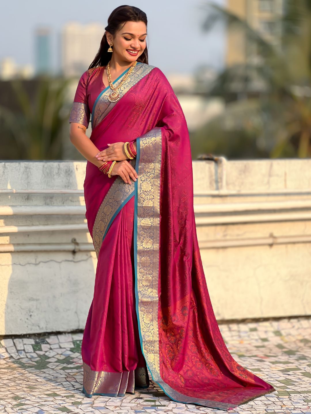 ethnic soft silk saree with contrast zari floral border and graceful drape