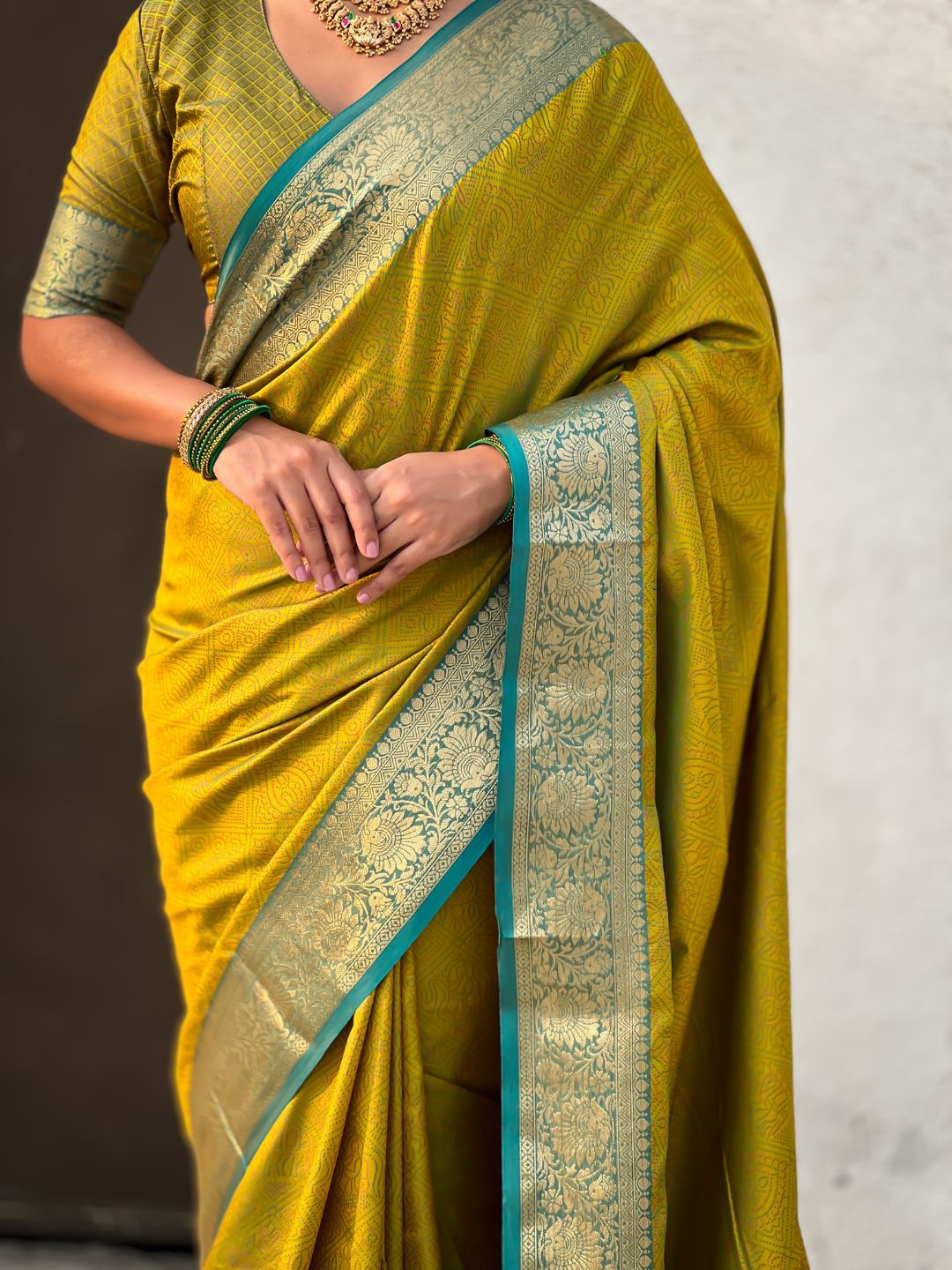 ethnic mehendi green saree with contrast floral border and heritage weaving