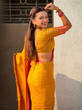 traditional yellow patola saree with running pallu and brocade blouse