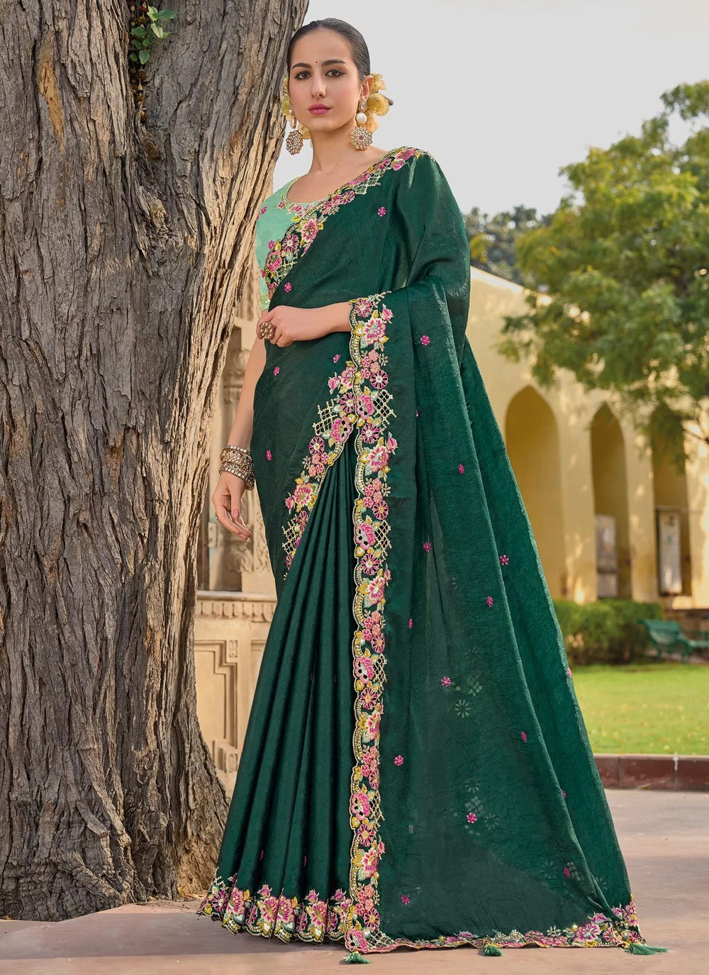 Elegant green tissue organza silk saree with embroidery and stone work