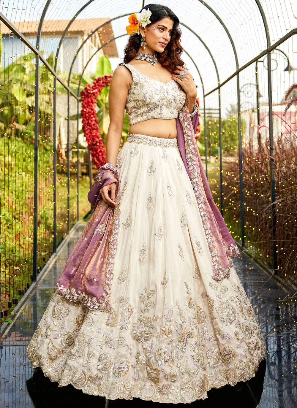 Grace meets glam in this purple tissue lehenga choli with a twirl-worthy flair and embroidered green dupatta