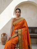 traditional orange paithani saree with peacock panel border