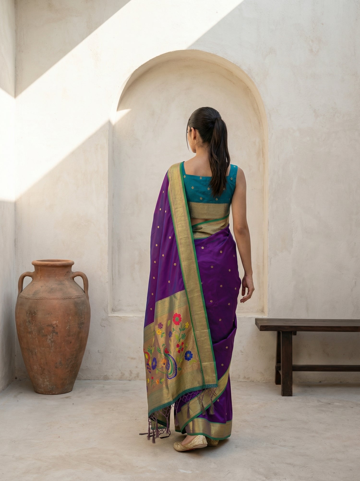 ethnic purple silk saree with classic peacock border design