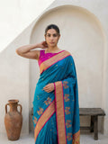 traditional rama green silk saree with peacock panel border