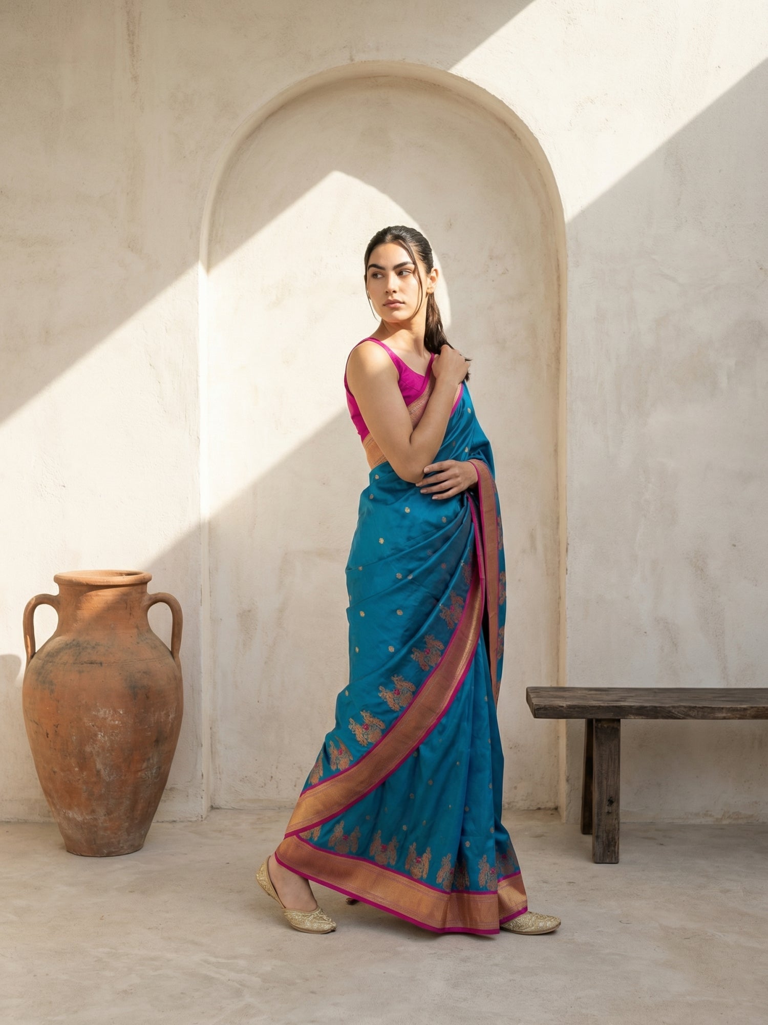 wedding wear rama green saree with graceful drape and woven detailing