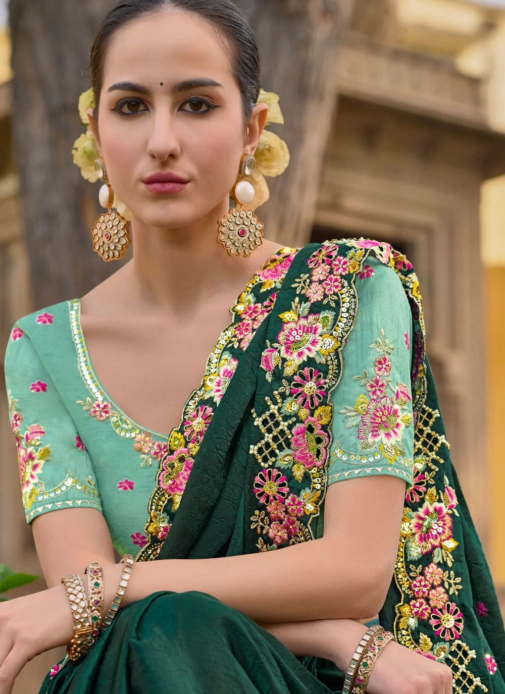 Banglory silk blouse with embroidery paired with organza saree