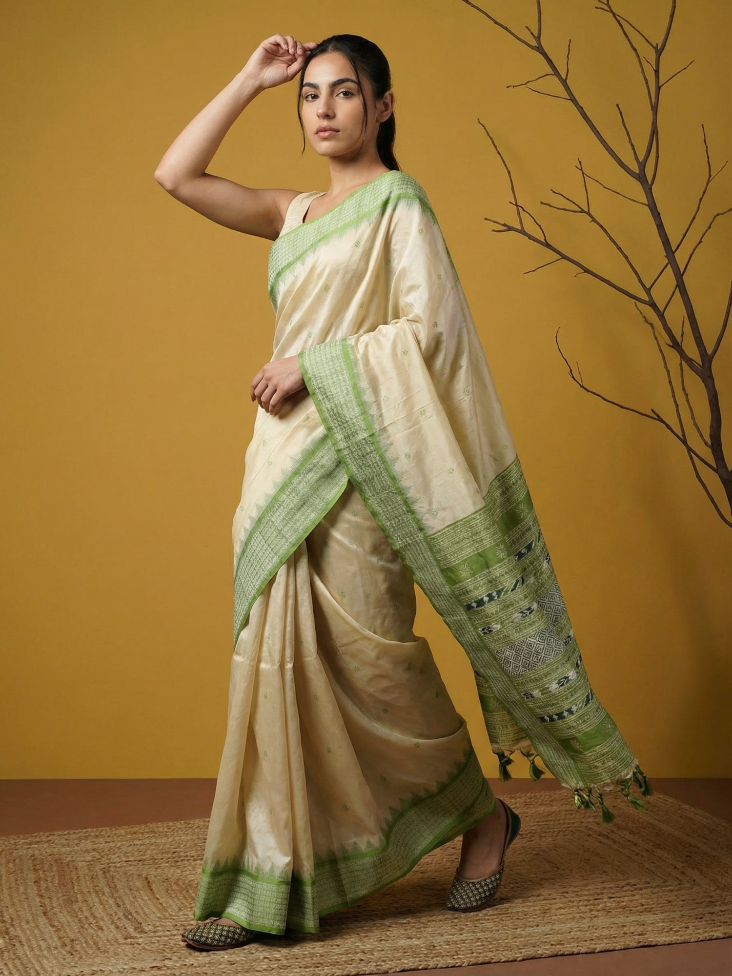festive pista green saree with woven pallu and tassel detailing