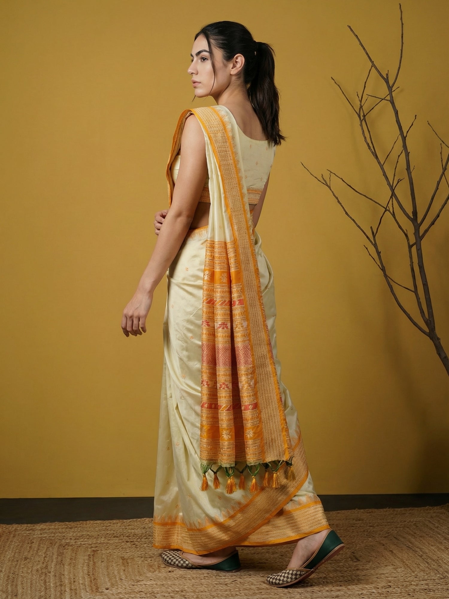 designer yellow saree with rich woven detailing and elegant appeal