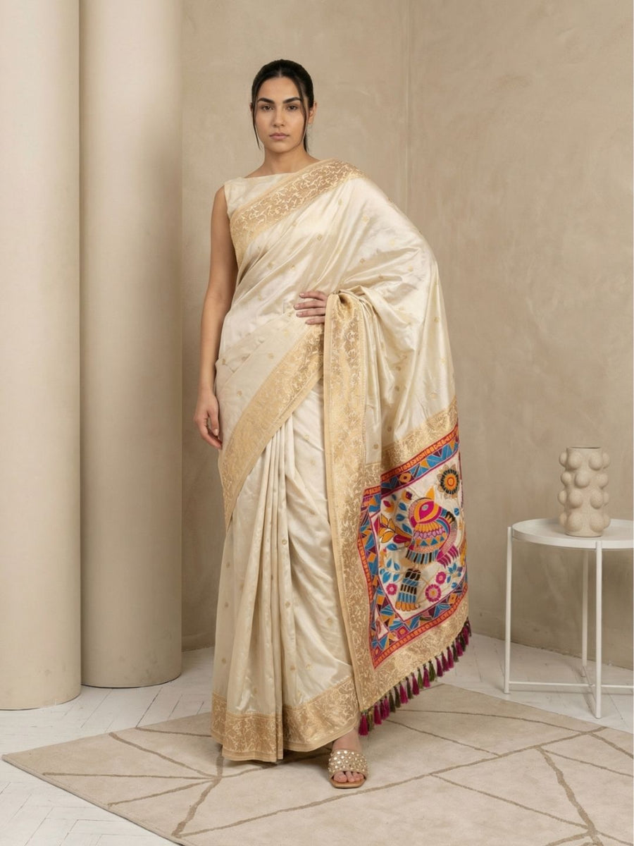 soft silk saree with delicate gold zari floral motifs and contrast meenakari pallu