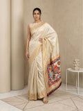 soft silk saree with delicate gold zari floral motifs and contrast meenakari pallu