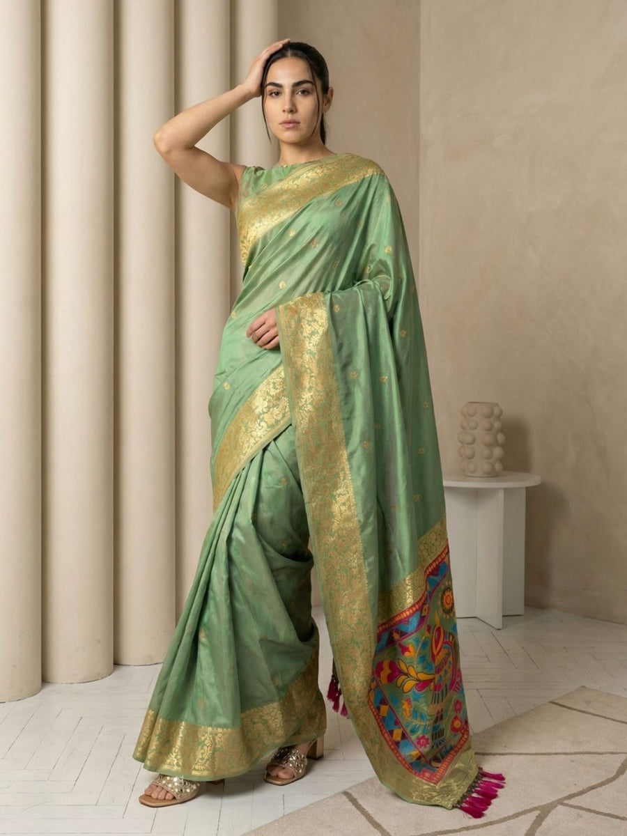 green soft silk saree with gold zari floral motifs and contrast meenakari pallu