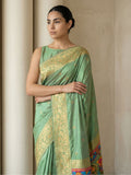 traditional green soft silk saree with floral motifs and rich pallu detail