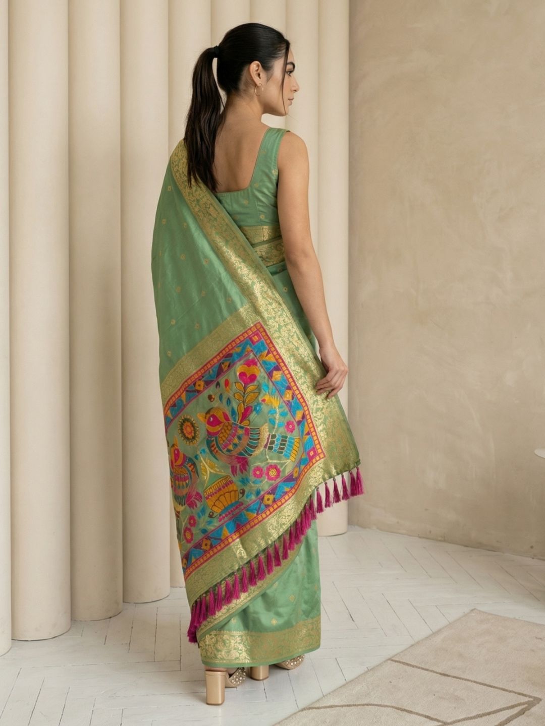 festive green saree with zari weaving and smooth elegant drape