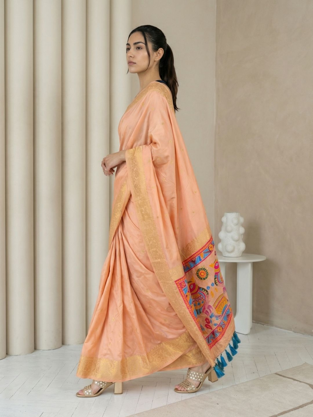 festive peach saree with zari weaving and smooth elegant drape