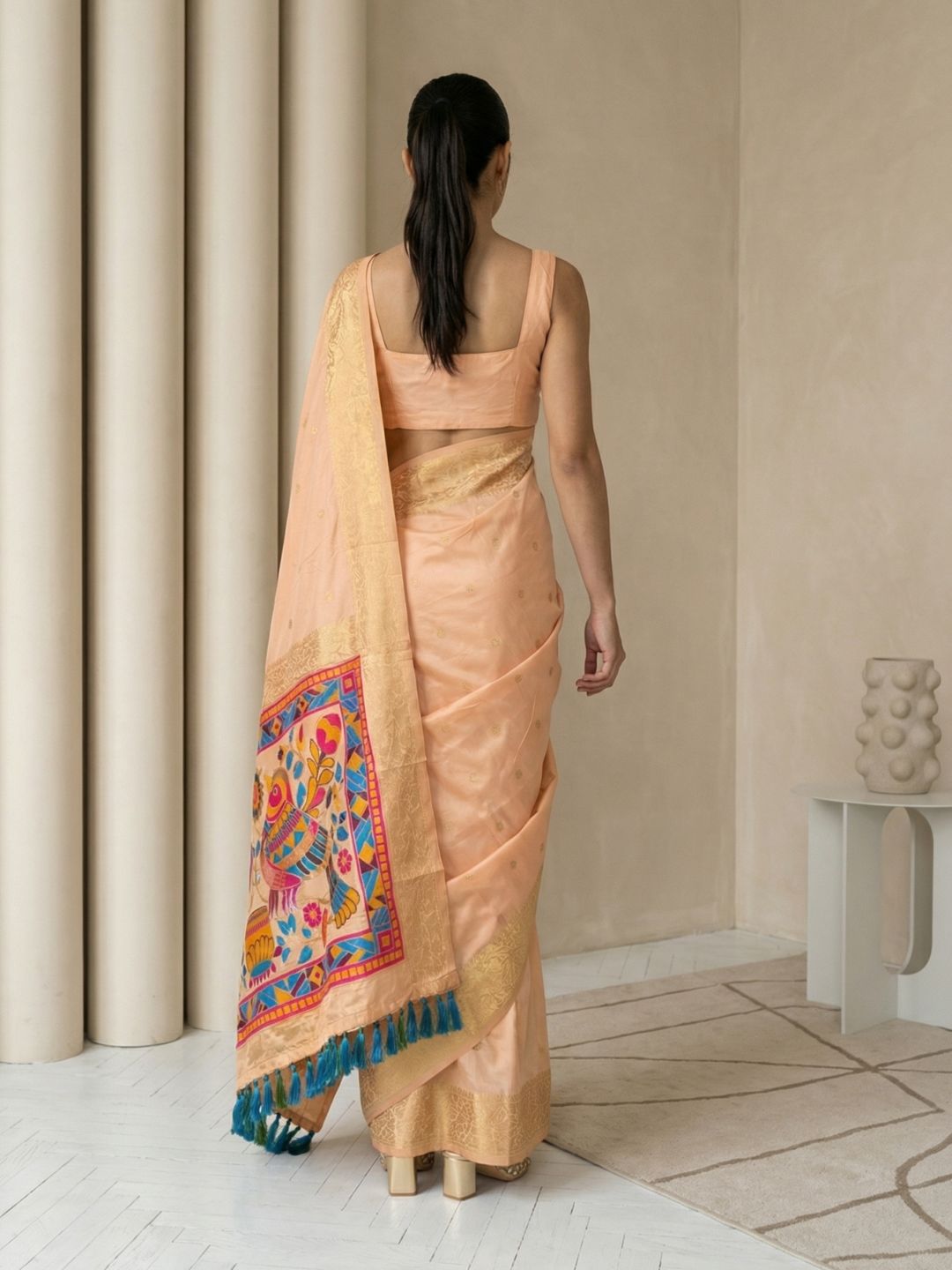 designer peach silk saree with unique sparrow pallu and classic finish