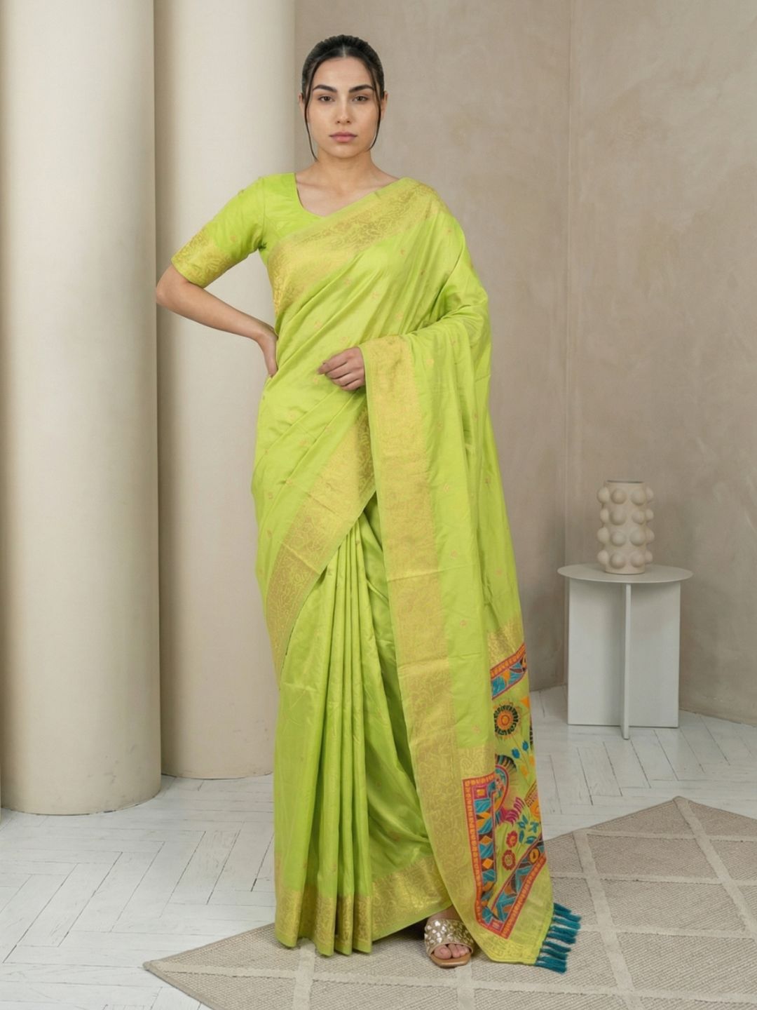 elegant pista green saree featuring sparrow design pallu and woven border