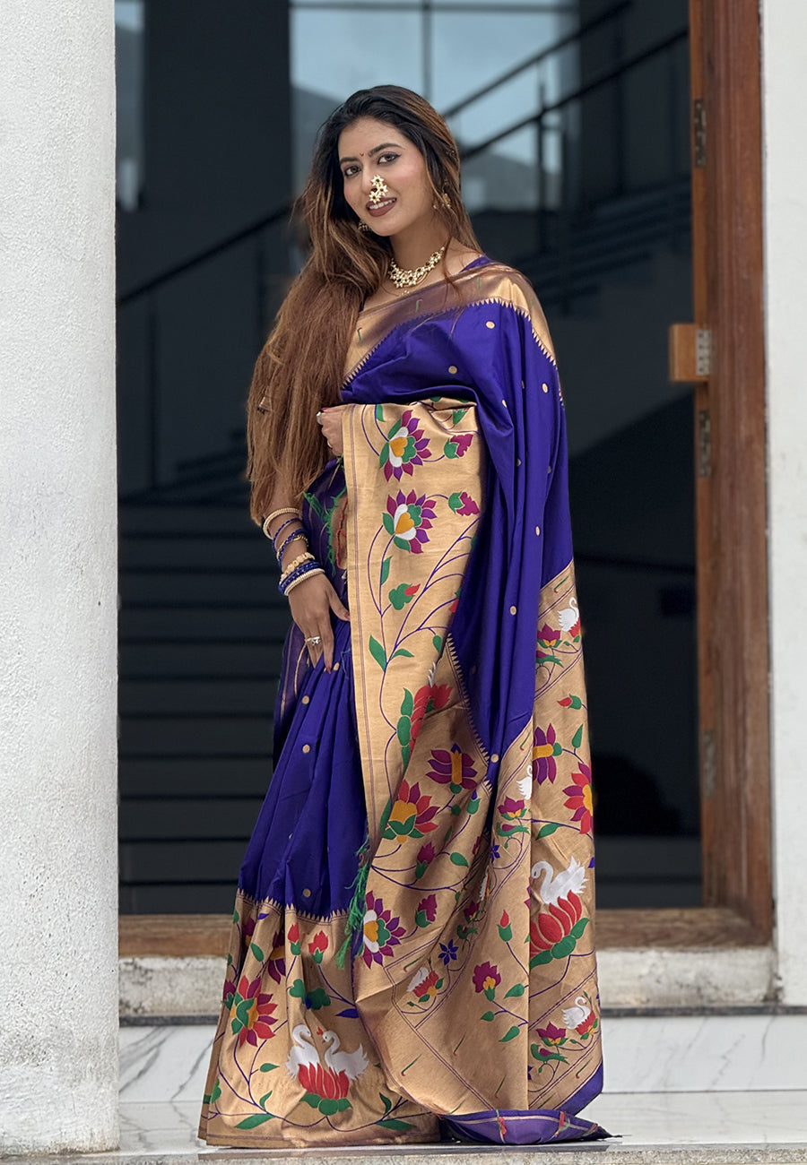 Sakshi in our Violet Paithani Silk Saree with Half Half Concept Big Border Zari Woven Saree
