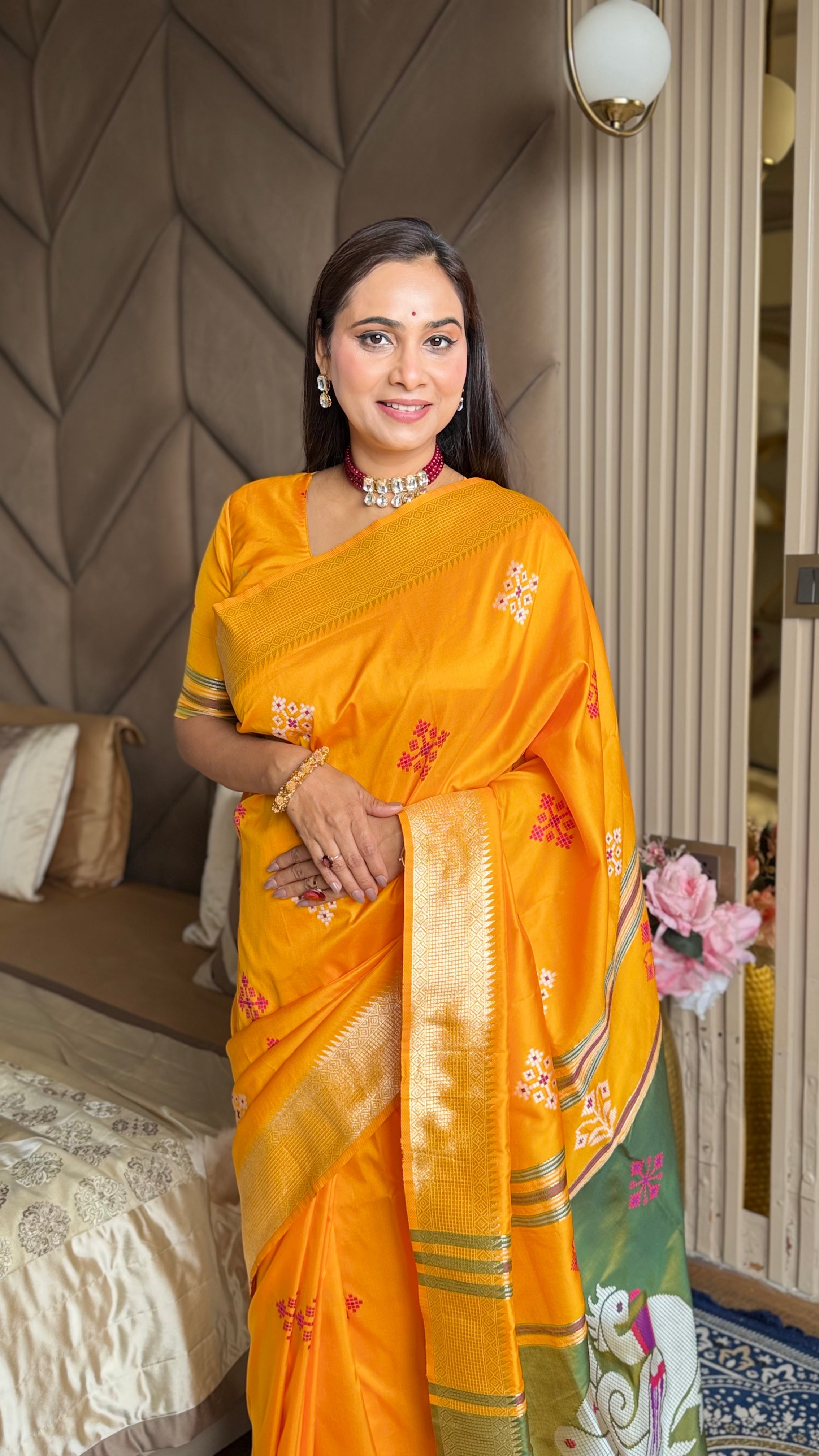 Orange Soft Silk Ikkat Patola Saree with Meenakari Motifs Peacock Pallu and Gold Zari Border