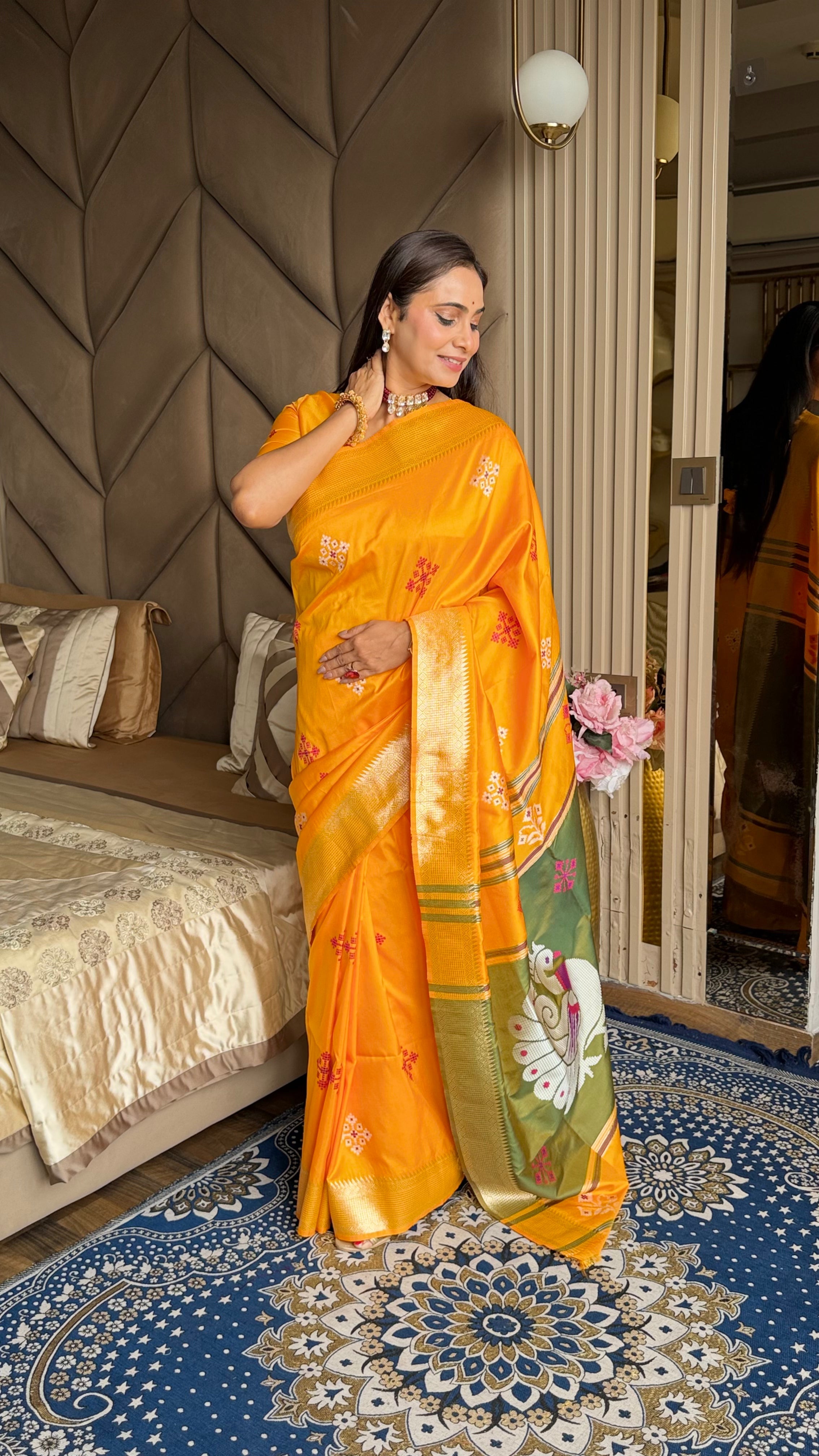 Orange Soft Silk Ikkat Patola Saree with Meenakari Motifs Peacock Pallu and Gold Zari Border