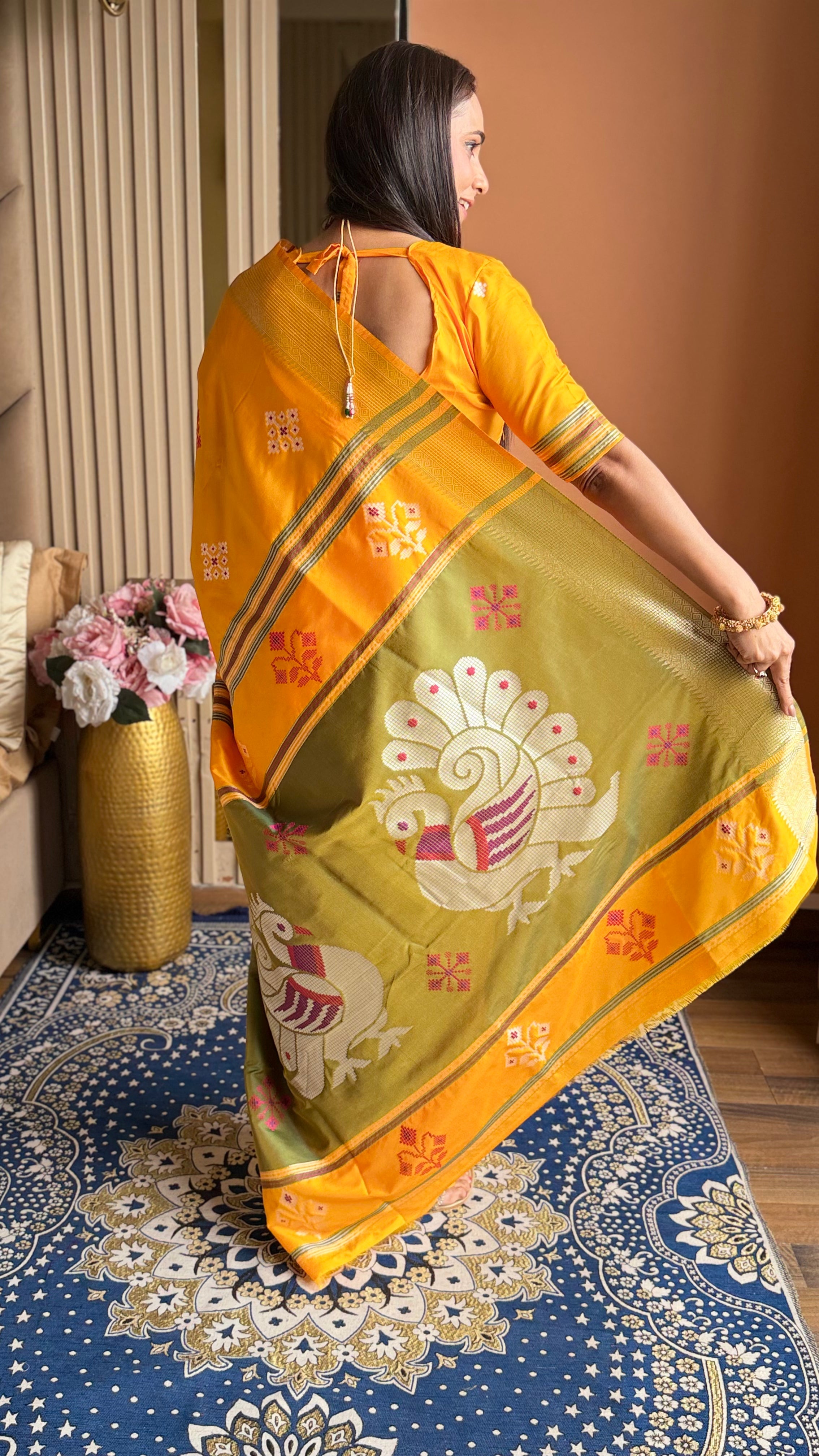 Orange Soft Silk Ikkat Patola Saree with Meenakari Motifs Peacock Pallu and Gold Zari Border