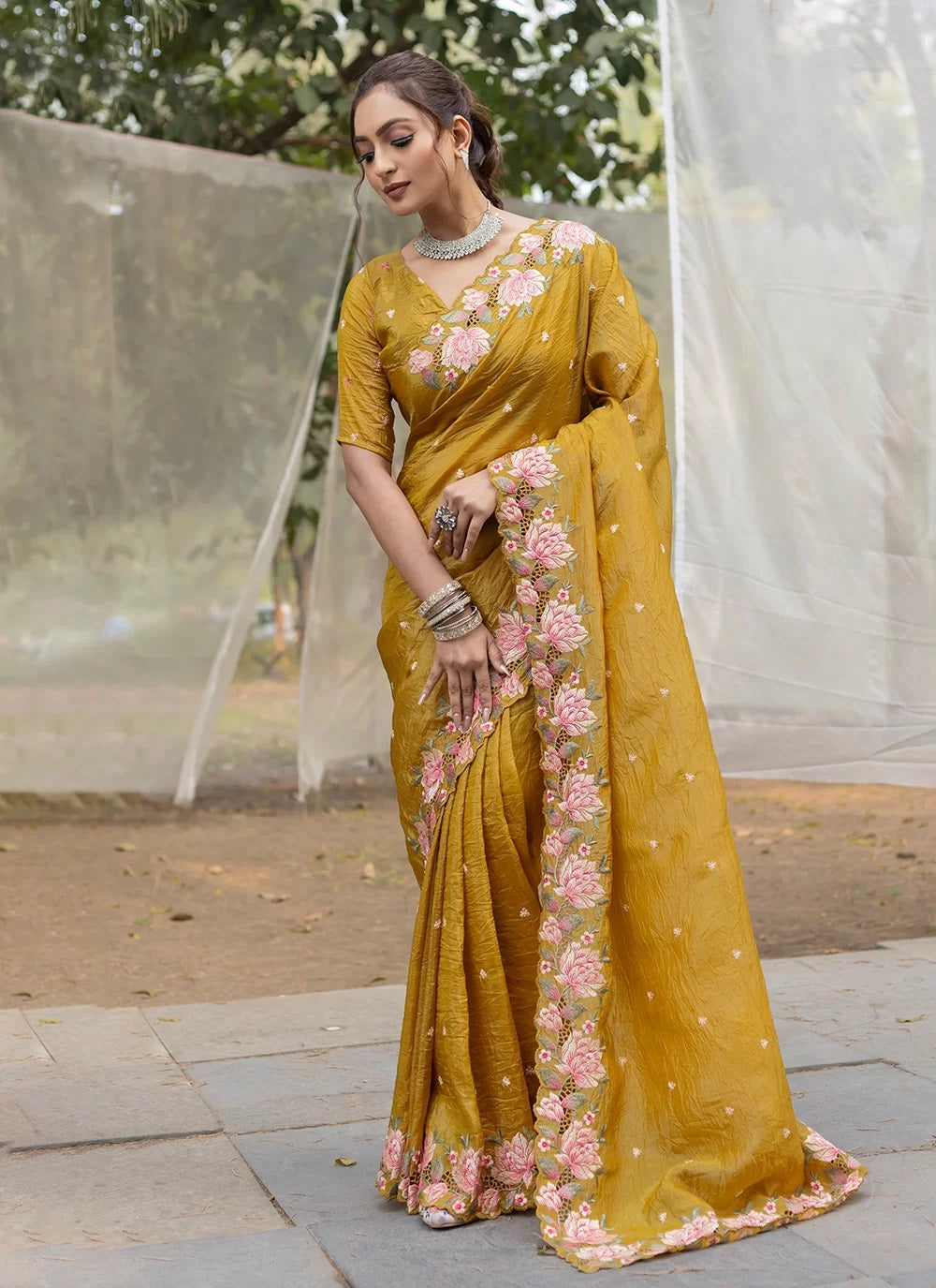 Mustard silk saree with intricate embroidery and stylish cut work, paired with running butti blouse – perfect for festive and ethnic wear