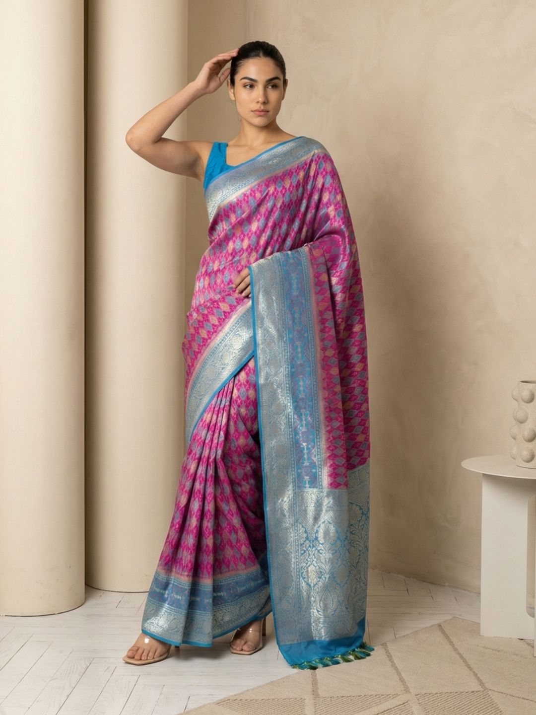 traditional patola saree with contrast brocade blouse and graceful drape
