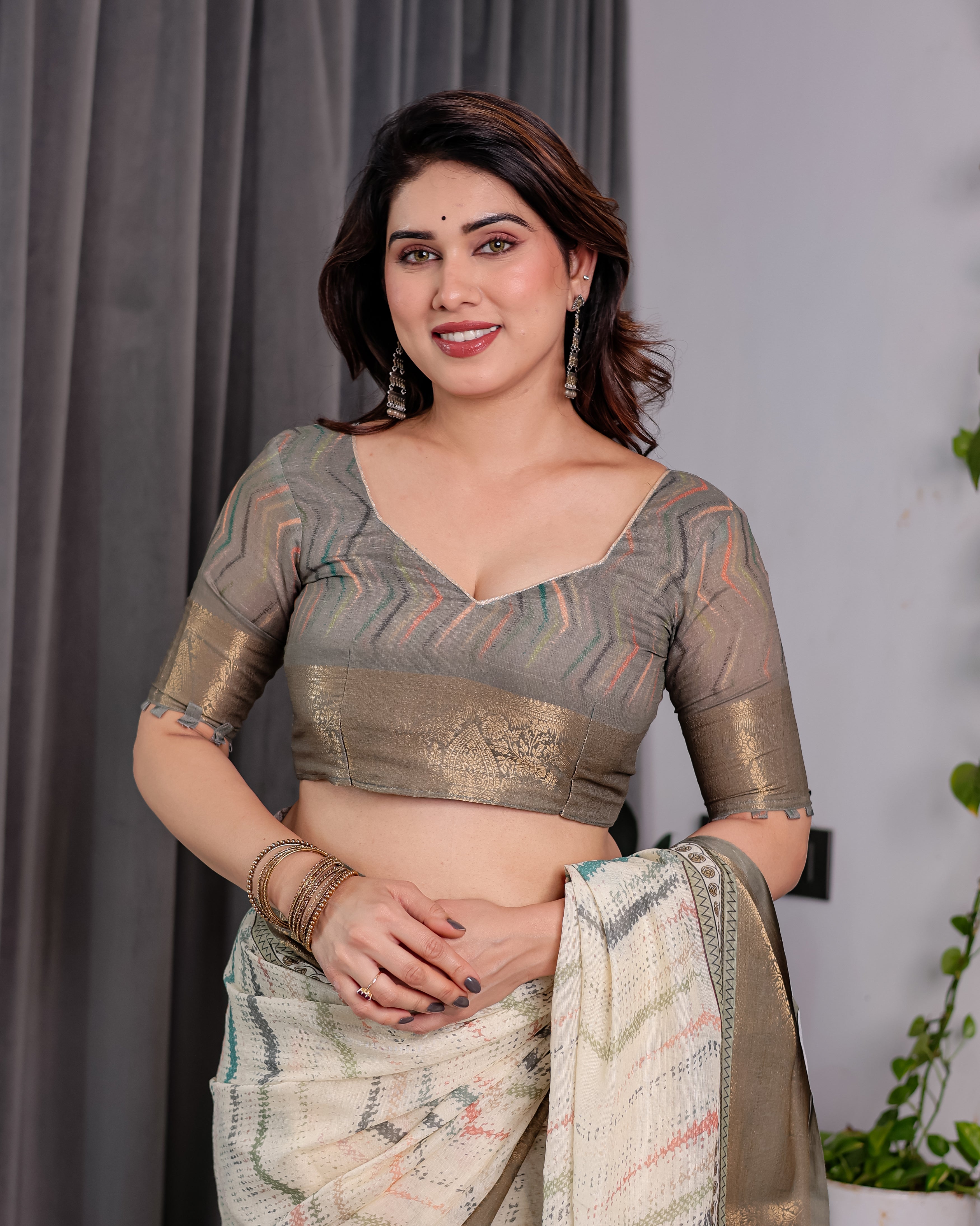 Elegant Cream & Gold Woven Ikat Silk Saree with Designer Border With Tassles