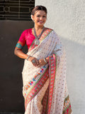 elegant white saree with traditional folk art border and pallu