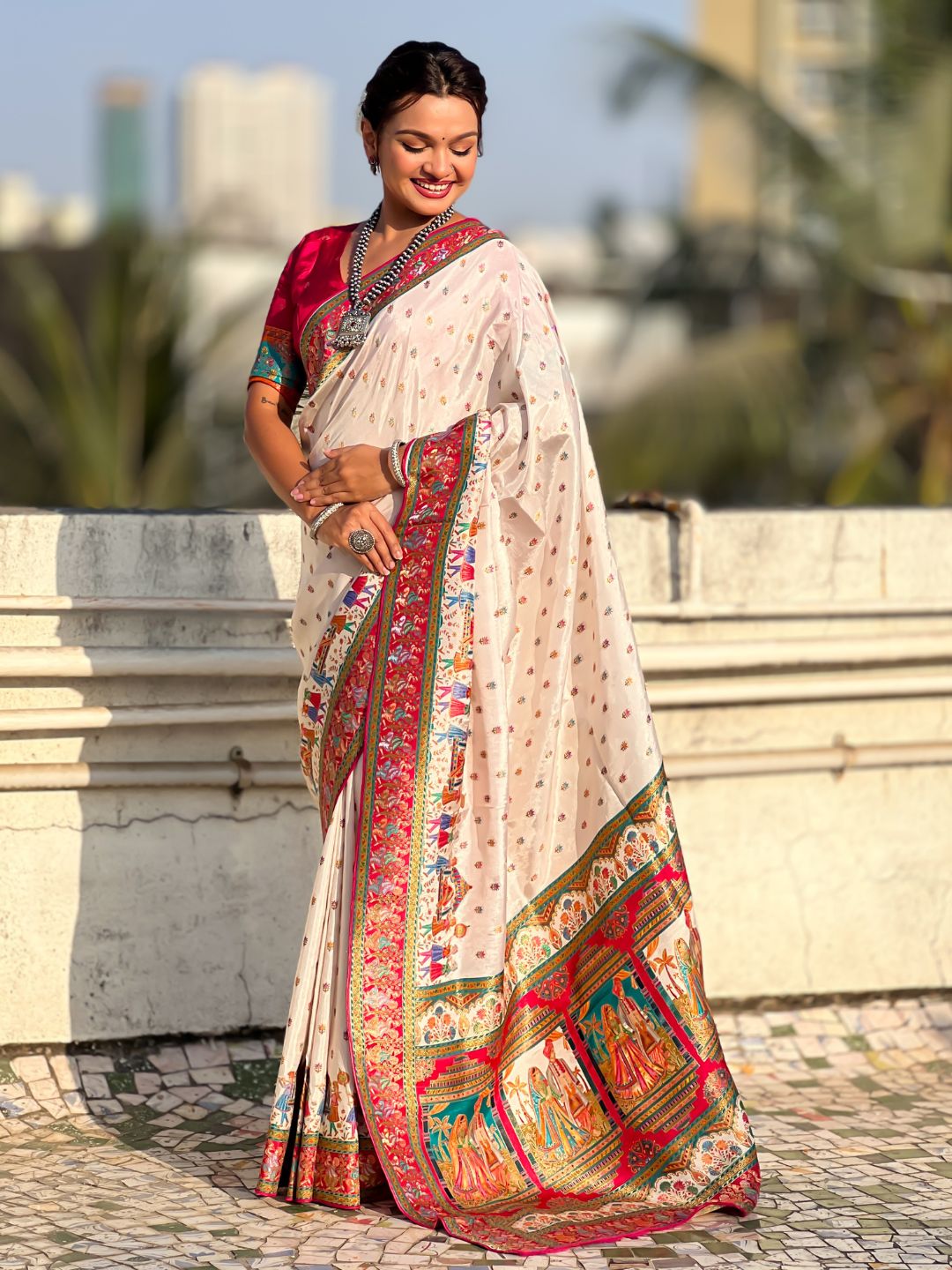 festive silk saree with artistic woven detailing and brocade blouse