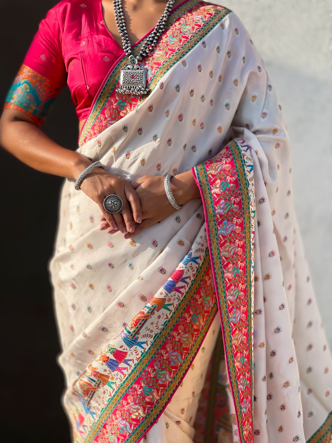 traditional white saree with heritage folk art inspired patterns
