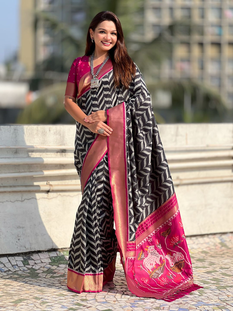 black soft silk saree with ikat motifs and zari weaving design