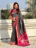 traditional black soft silk saree with woven ikat pattern and brocade blouse