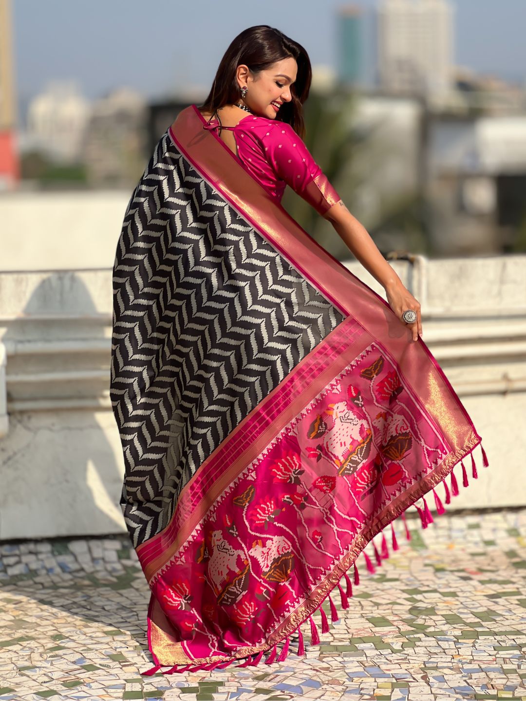 festive black saree with zari weaving and smooth elegant drape