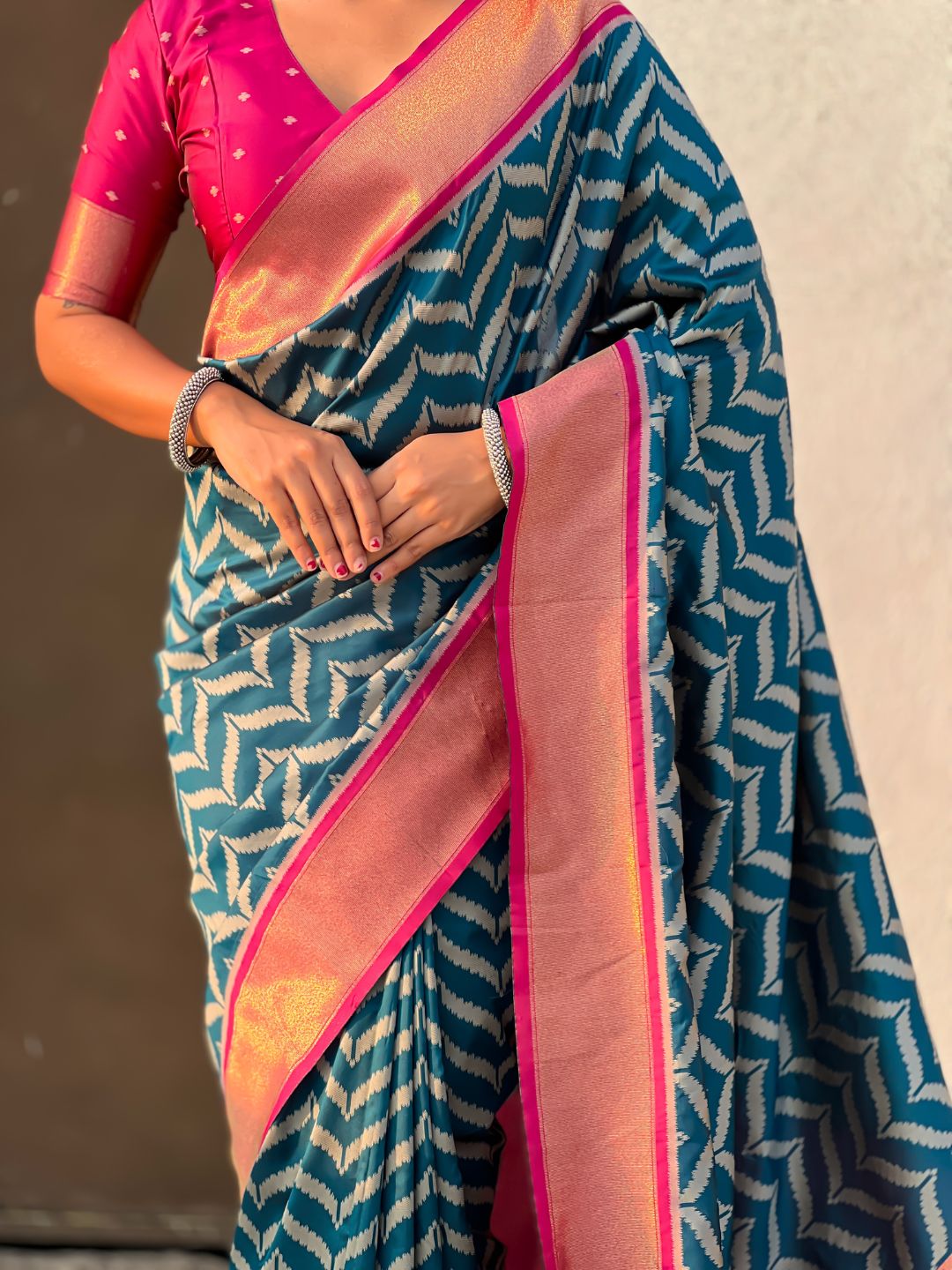 designer denim blue silk saree with heritage motifs and contrast blouse