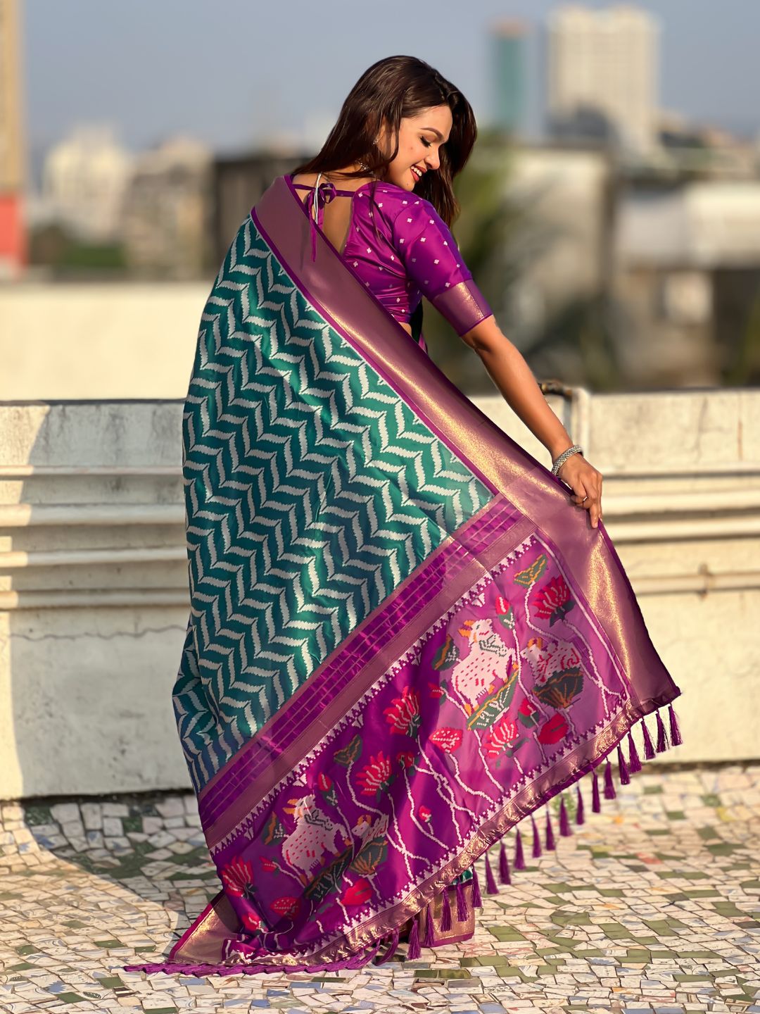 designer soft silk saree with traditional motifs and smooth drape
