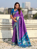 traditional purple soft silk saree with woven ikat pattern and brocade blouse