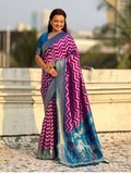 traditional wine soft silk saree with woven ikat pattern and brocade blouse
