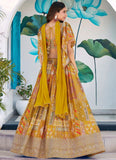 Woman in a yellow and patterned traditional outfit with a floral background