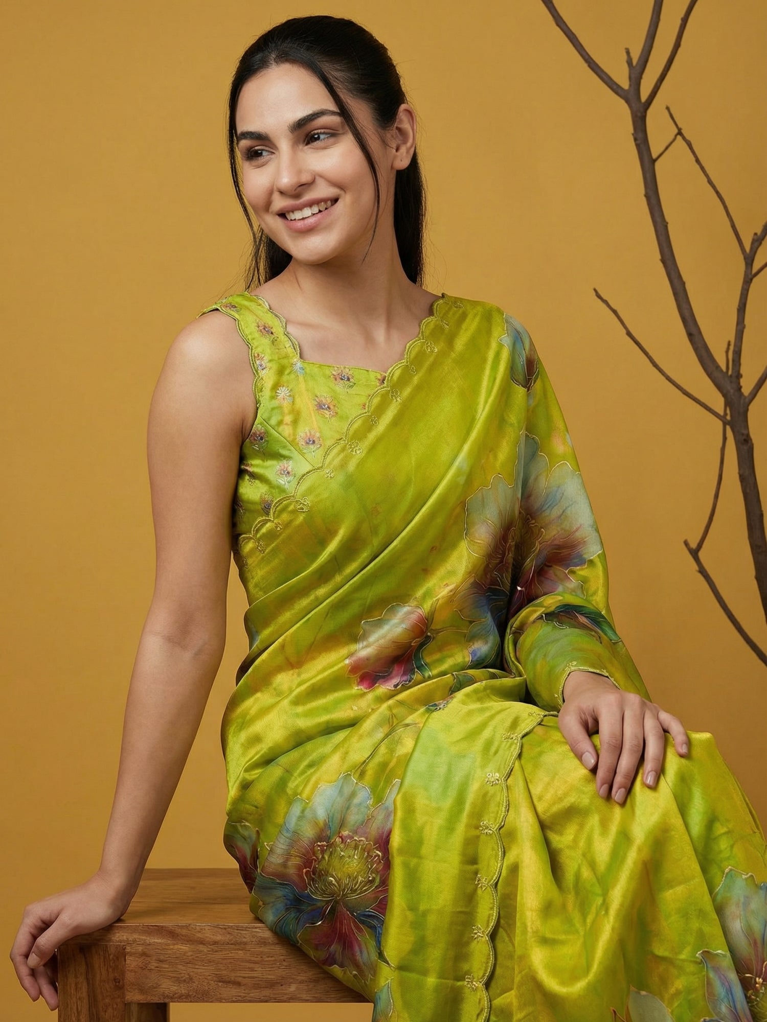 designer satin saree in mehendi green with vibrant floral patterns