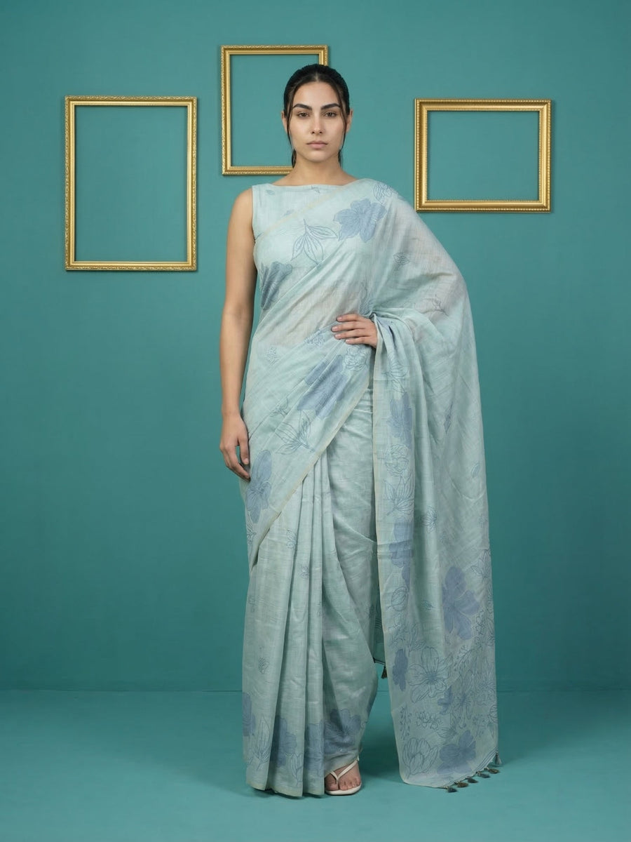 sky blue muga cotton saree with elegant pencil art detailing