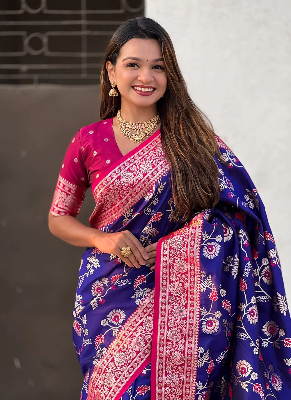 Blue Banarasi silk saree with rose gold zari meenakari jaal and contrast pallu