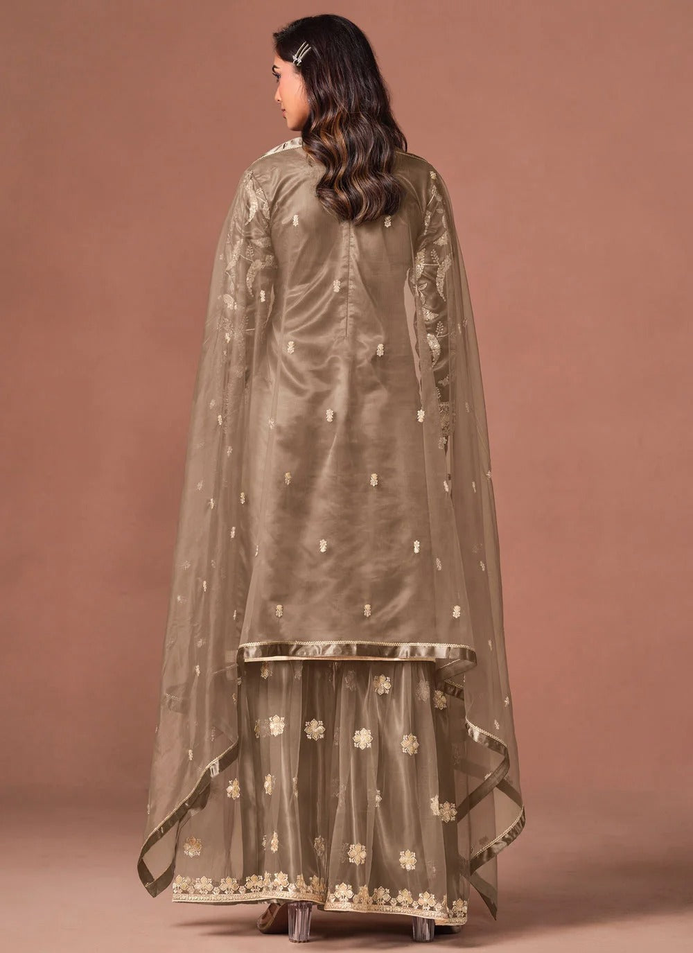 Brown net embroidered suit set with matching palazzo bottom and dupatta.