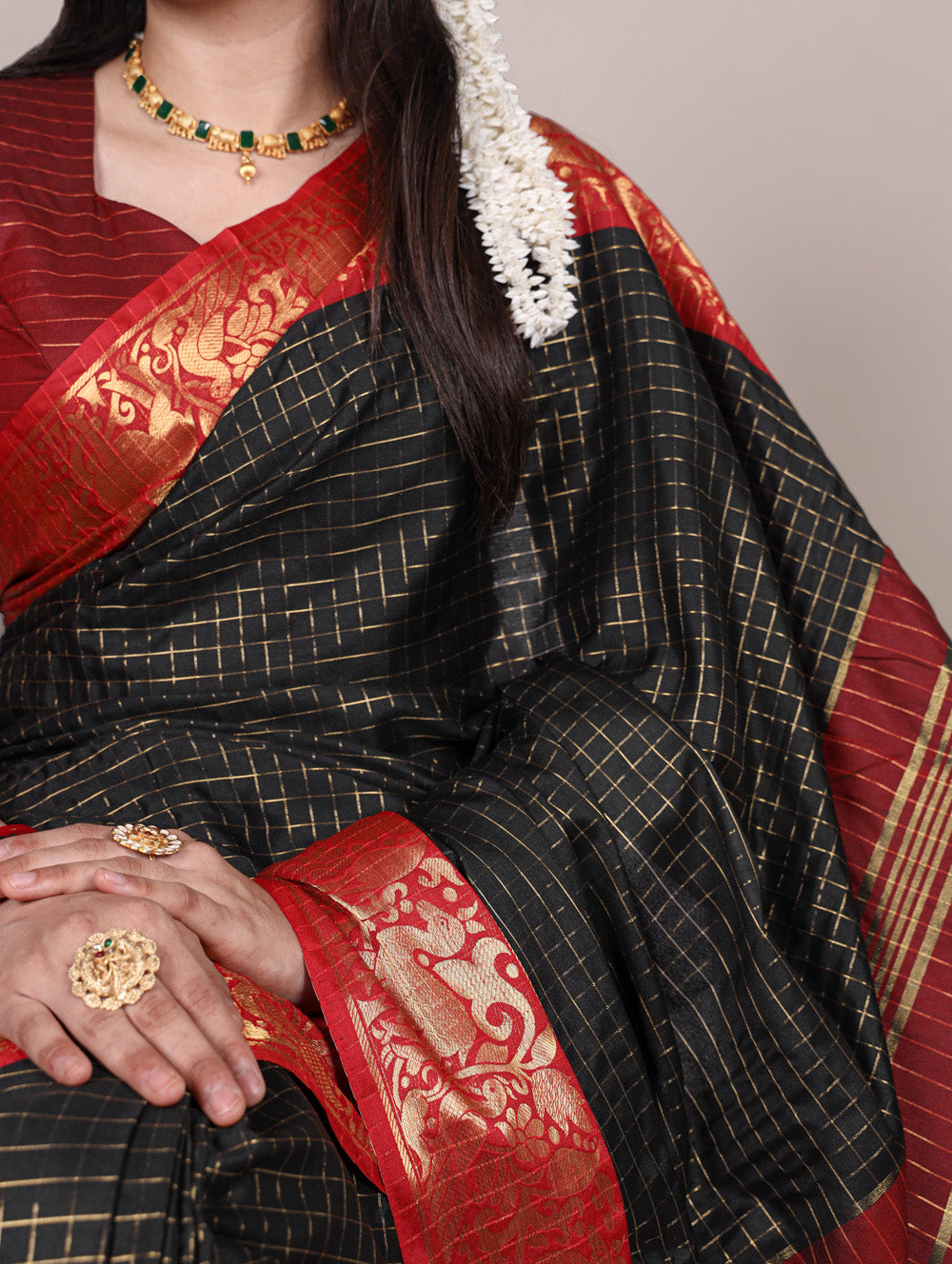 Zari woven black saree with unstitched blouse