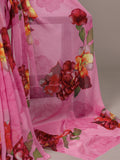 Pink fabric with floral patterns on a plain background