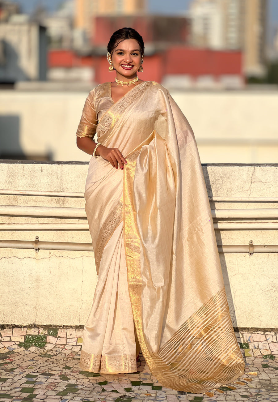 Graceful Cream Tussar Silk Saree with Zari Woven Border