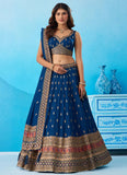 Designer engagement lehenga in morpeach Chinnon Silk featuring sequins, thread and zari embroidery with a matching embroidered dupatta and decorative tassels.