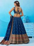 Elegant morpeach Chinnon Silk engagement lehenga with intricate zari embroidery and a matching embroidered dupatta.