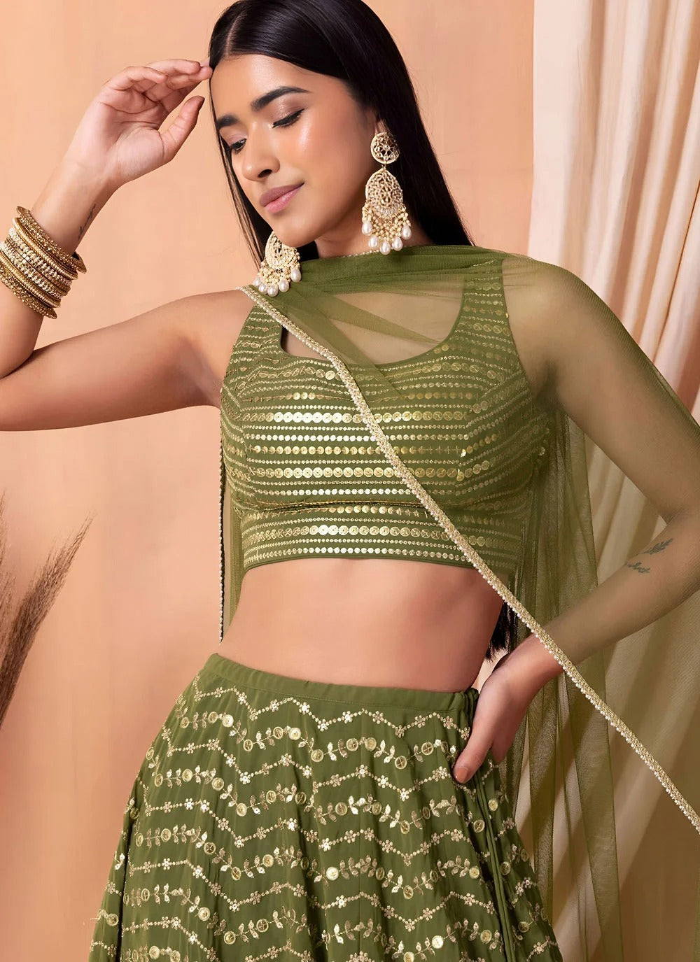 Thread embroidered green lehenga with organza dupatta
