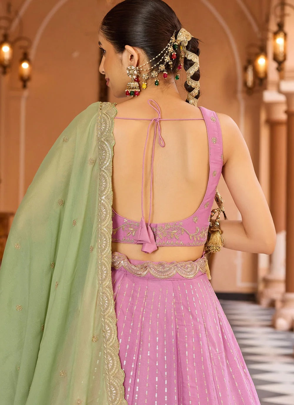 Pink tissue silk ring ceremony lehenga with zari embroidery