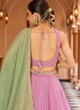 Pink tissue silk ring ceremony lehenga with zari embroidery